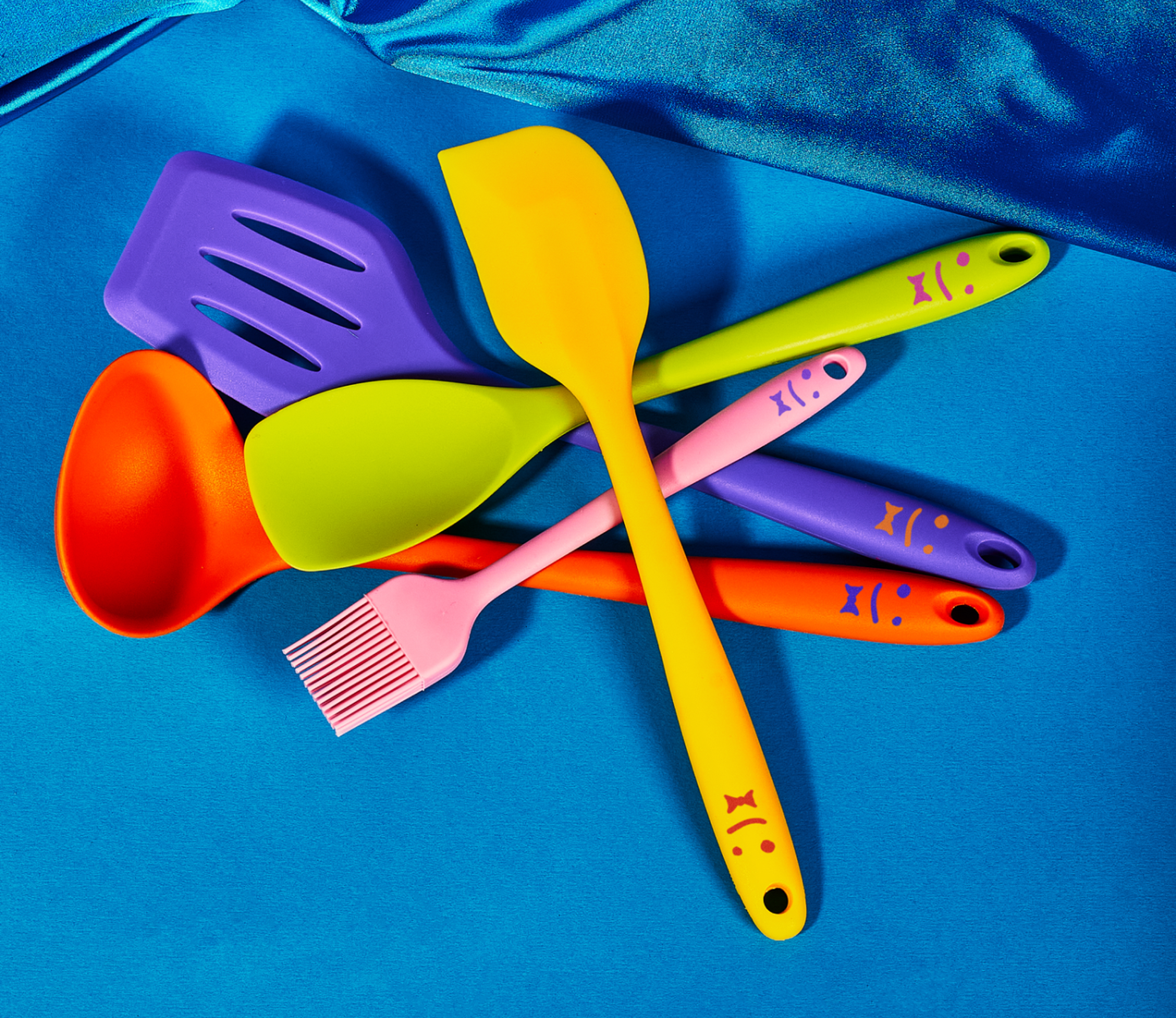 grouping of multicolored staff cooking utensils