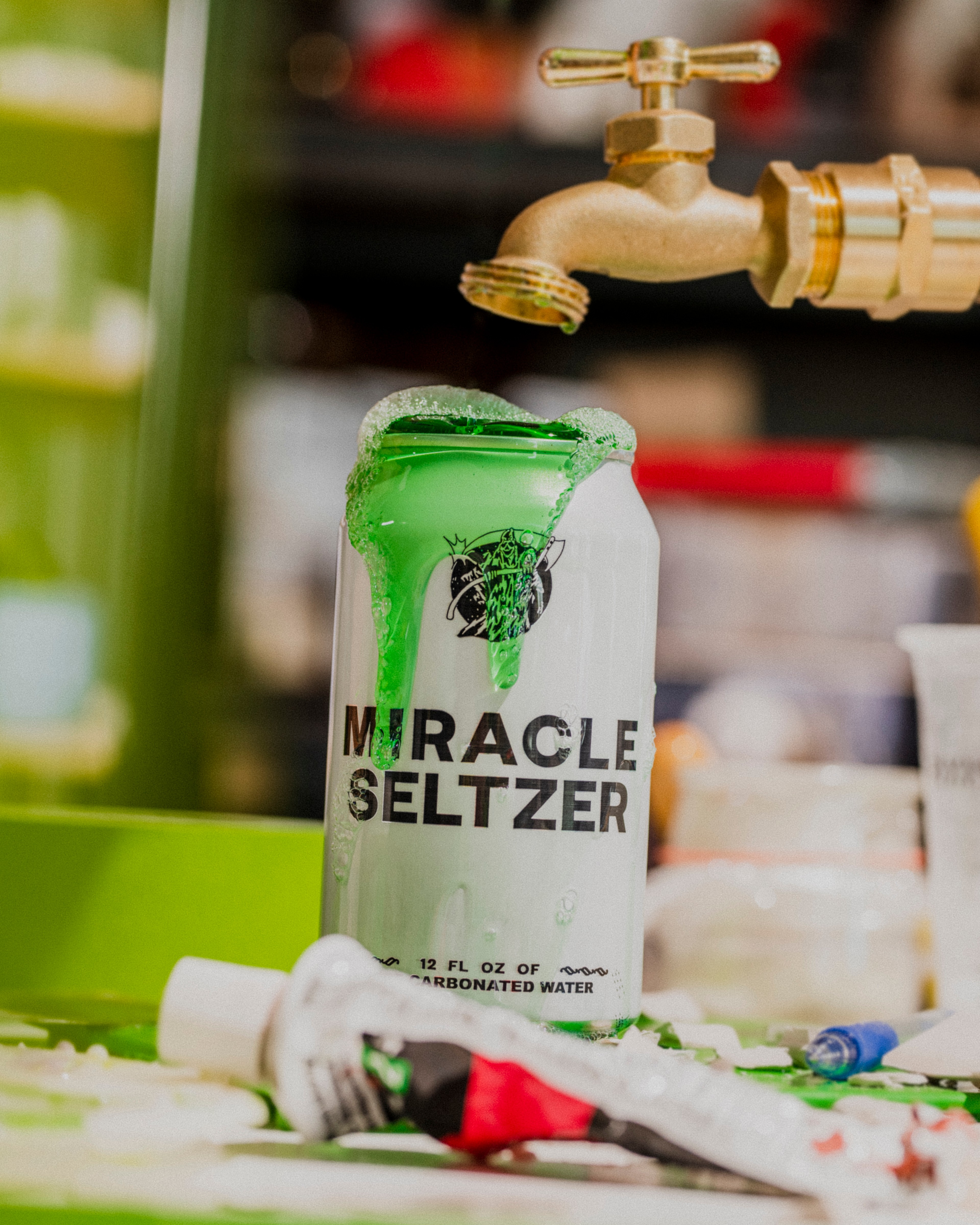 miracle seltzer can with green goo poured in