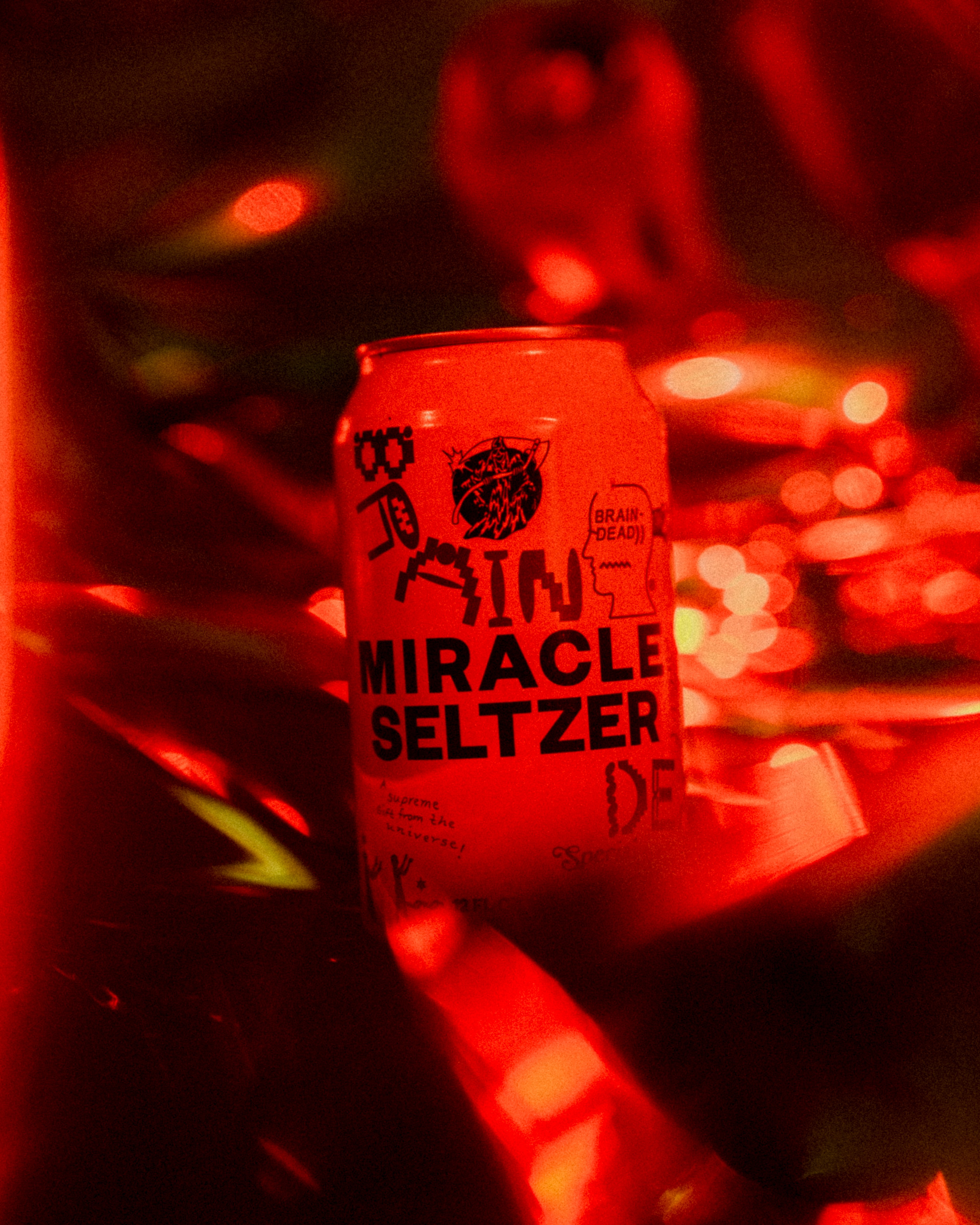 photo of miracle selzter can under a red light