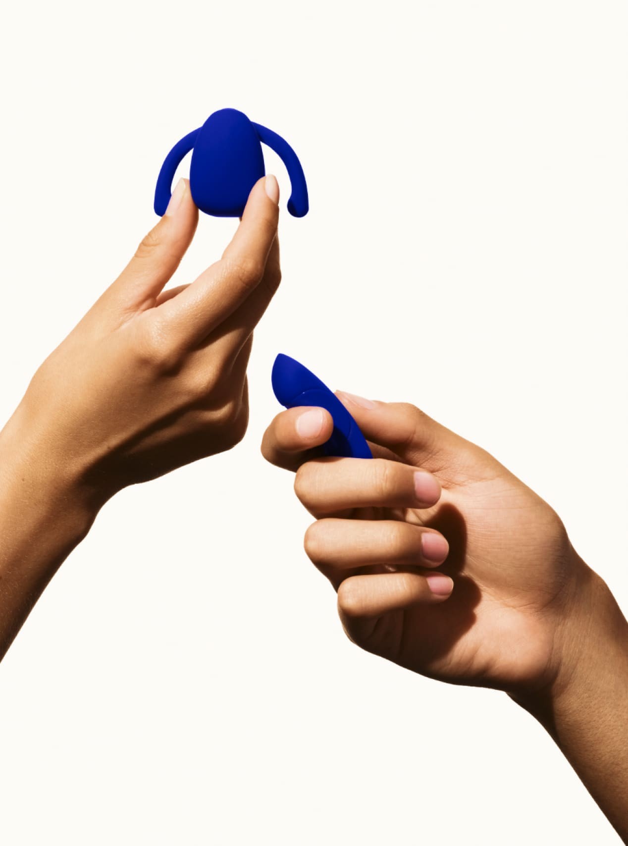 Dame Eva product in hand with male hand holding remote