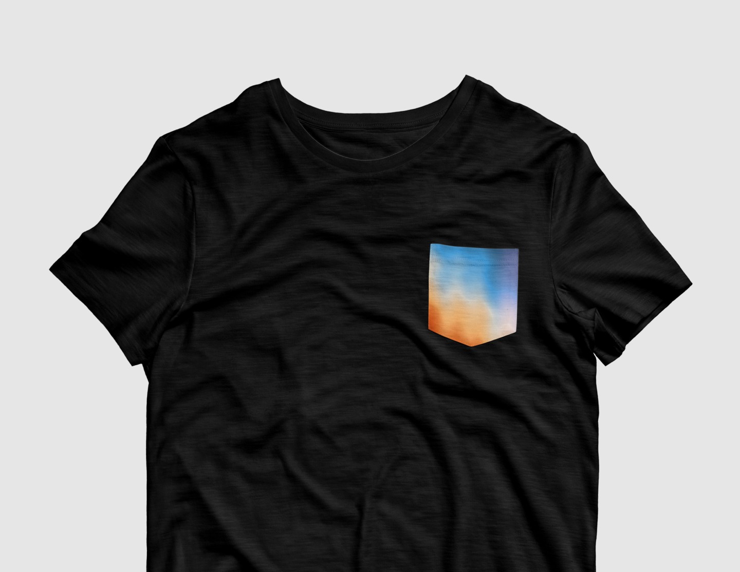 saturn awards pocket tee with a gradient over the pocket