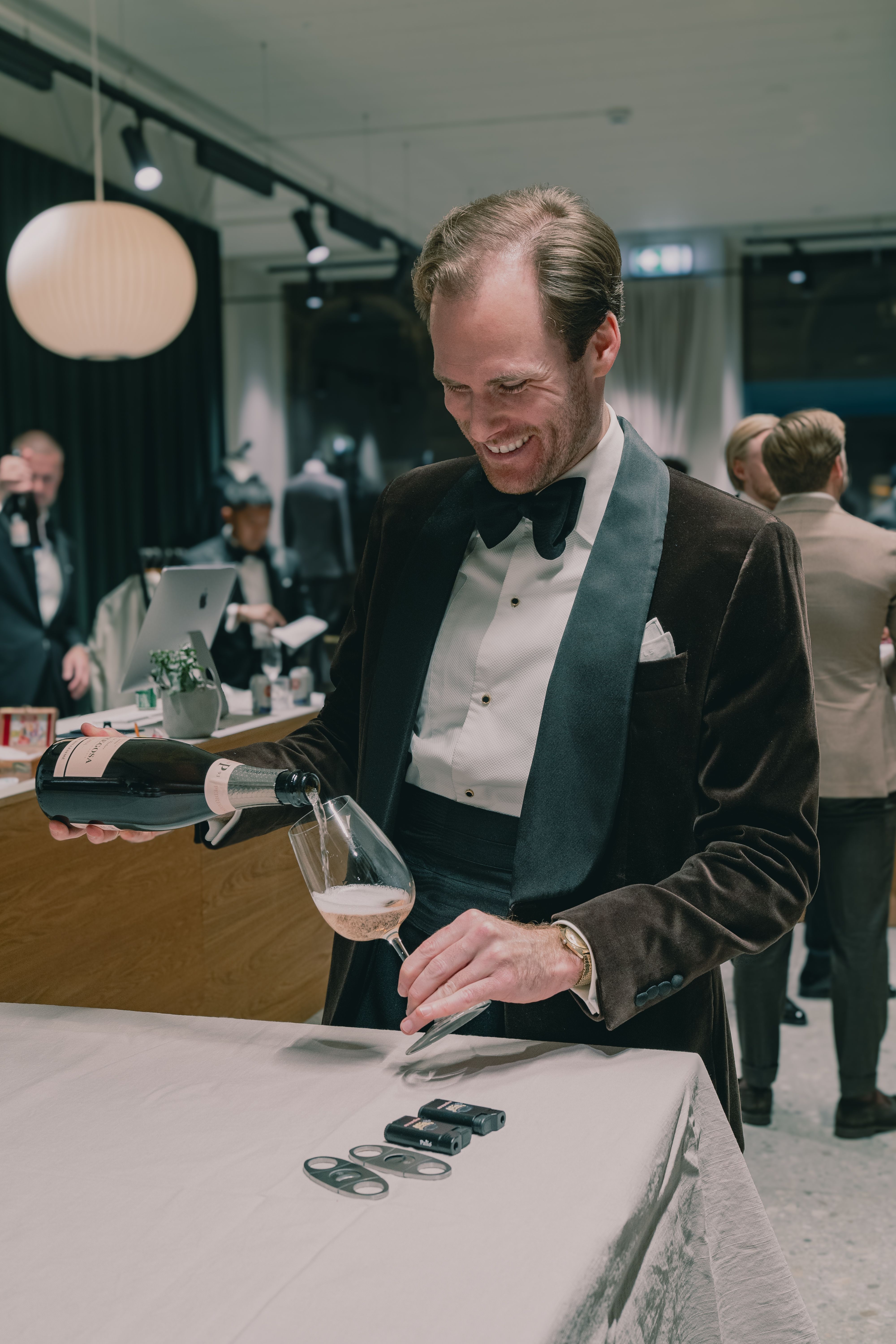 Smiling man pouring champagne