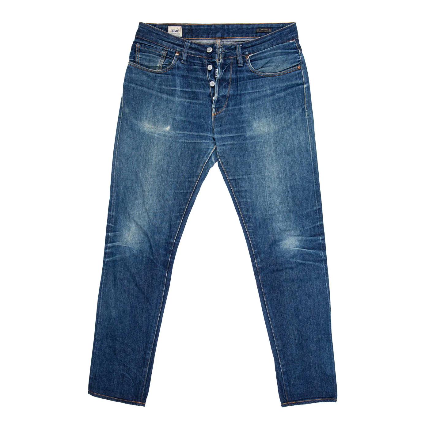Faded blue jeans with a button fly.