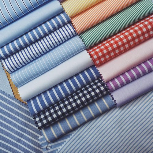 a bunch of different types of fabrics are stacked on top of each other .