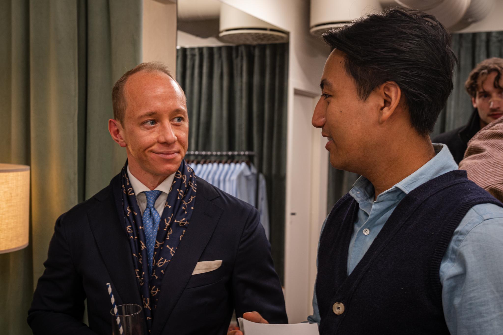 Two well dressed men in conversation