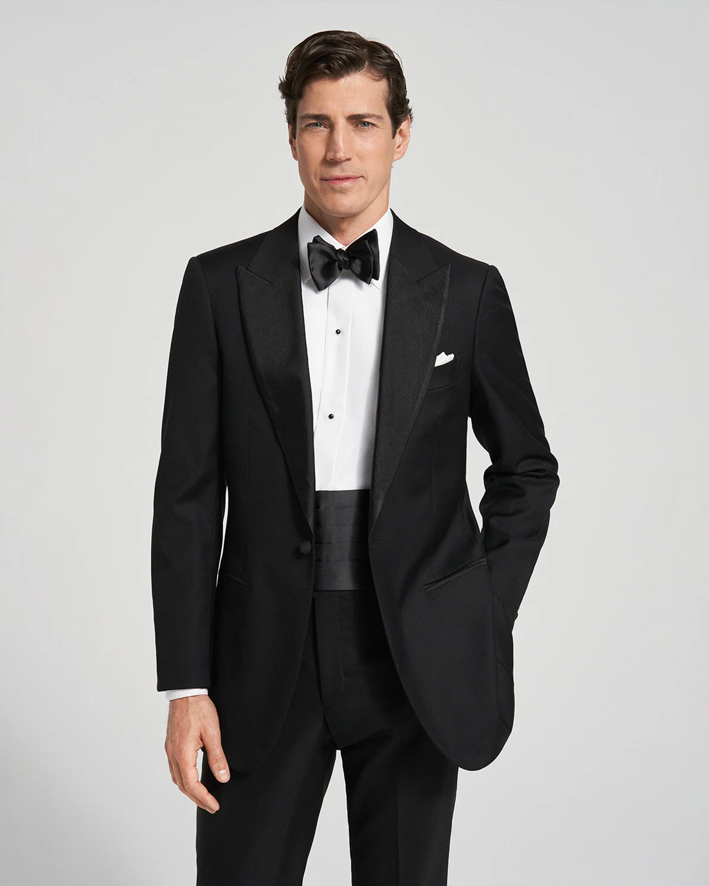 a man in a tuxedo with a bow tie