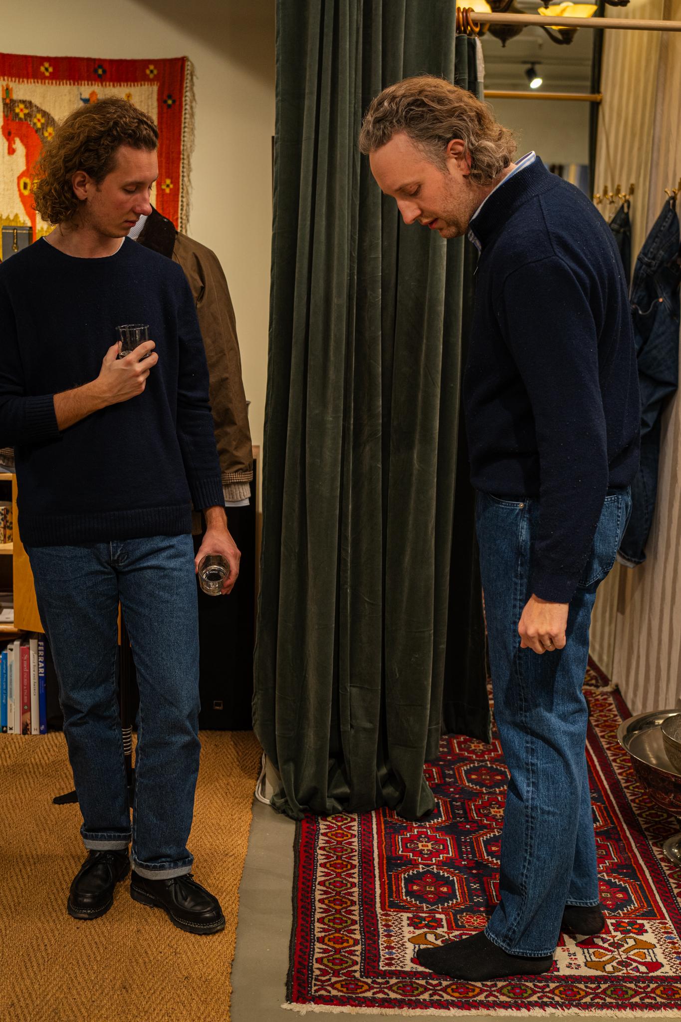 Customers trying on jeans