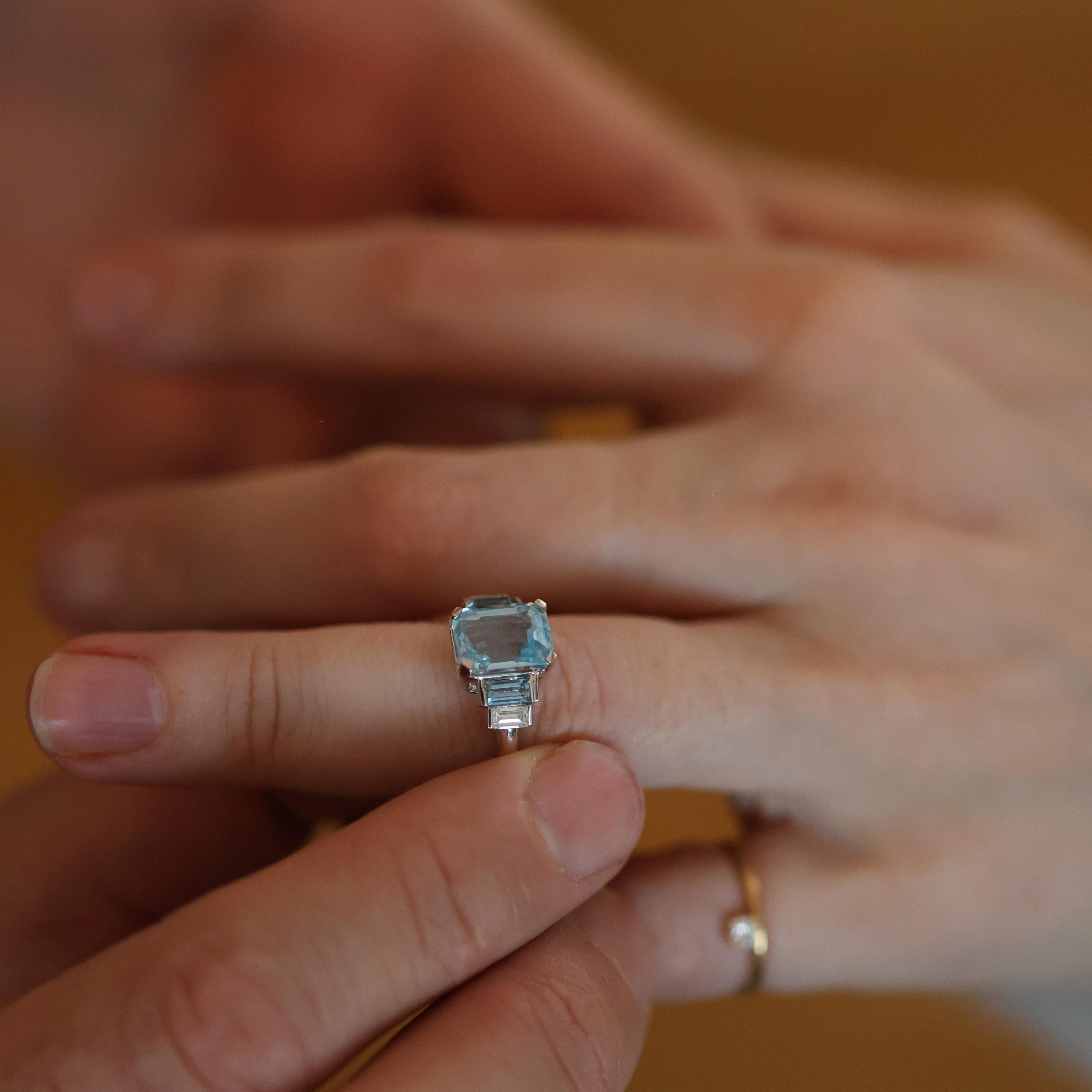 Emerald-cut aquamarine, white gold, worn, close view