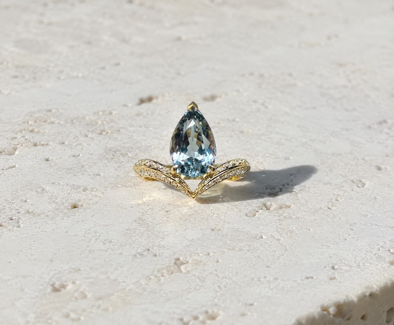 Pear-cut grey-blue spinel, diamond wishbone band, yellow gold