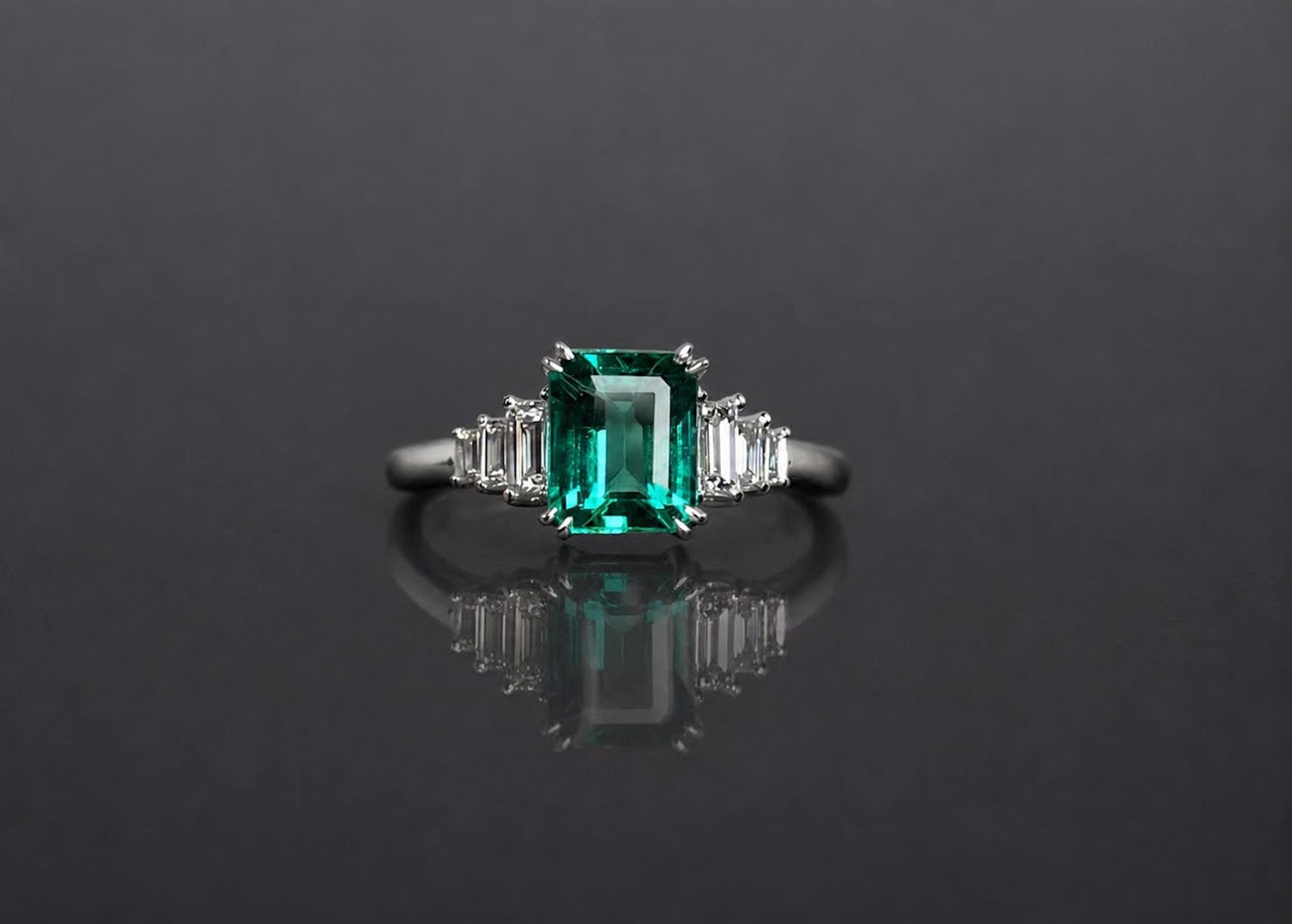Emerald-cut green emerald, step-cut diamond sides, white gold
