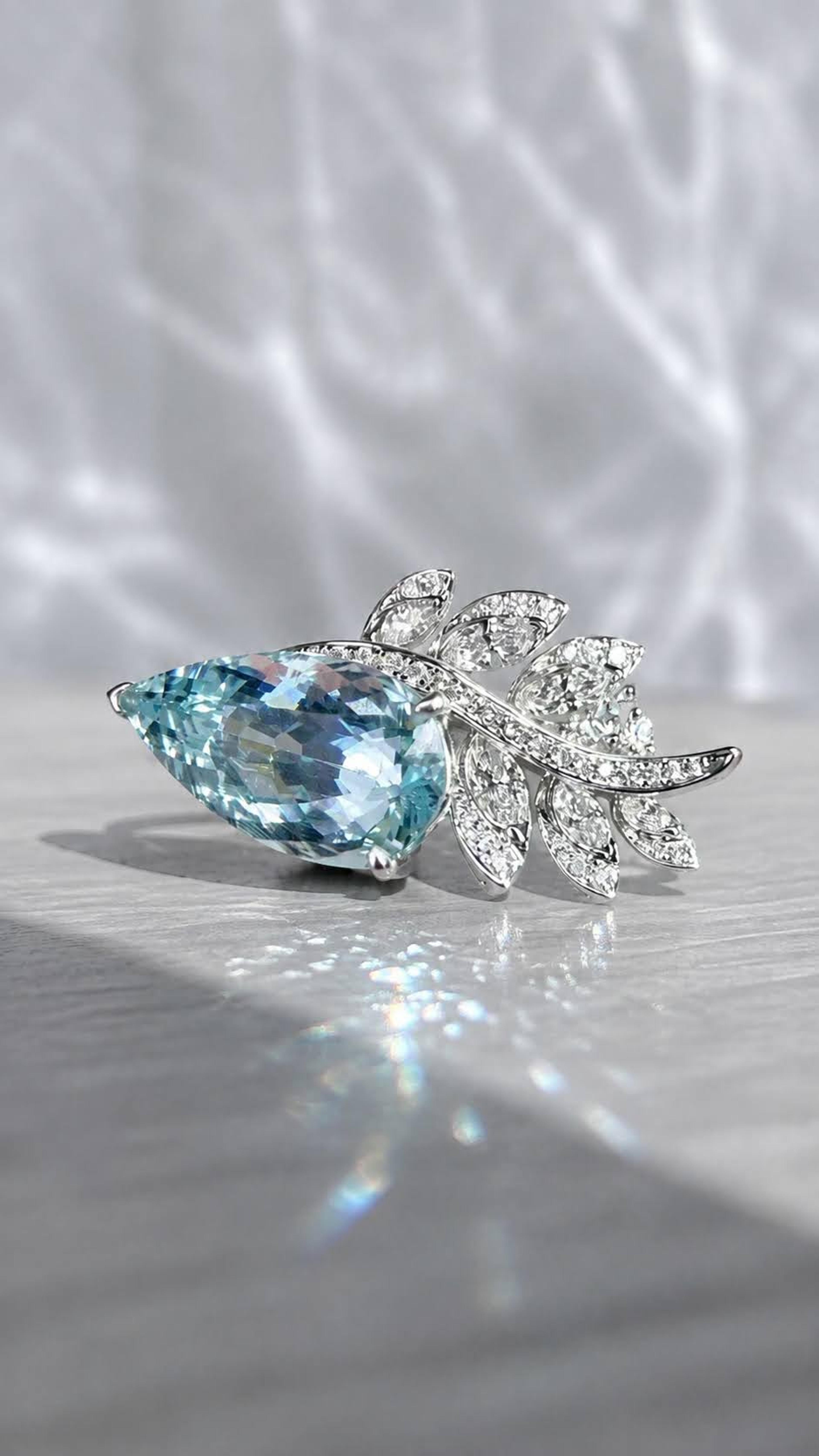 Pear-cut aquamarine and diamond leaves, white gold, angled