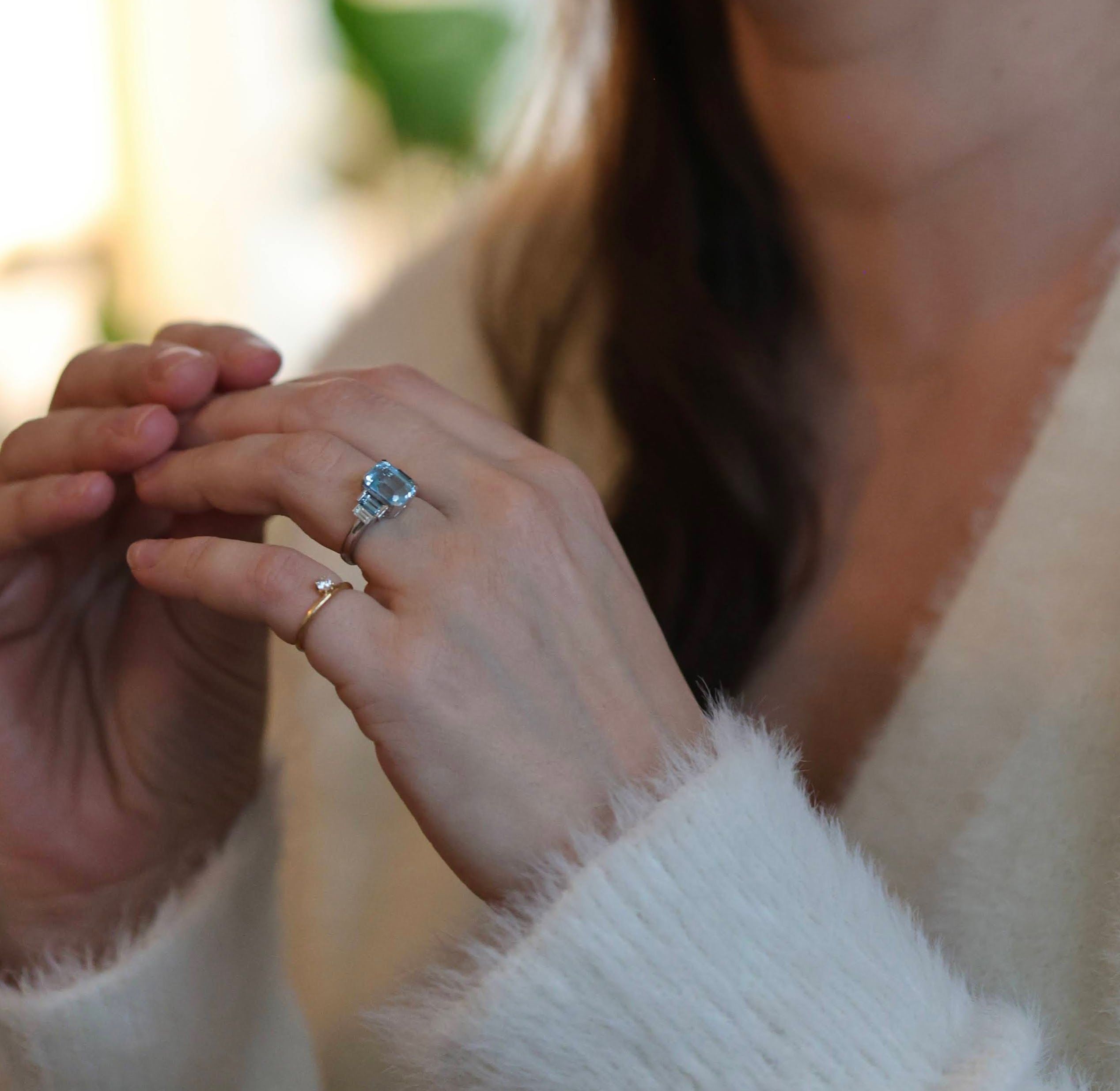 Emerald-cut aquamarine ring, white gold, worn