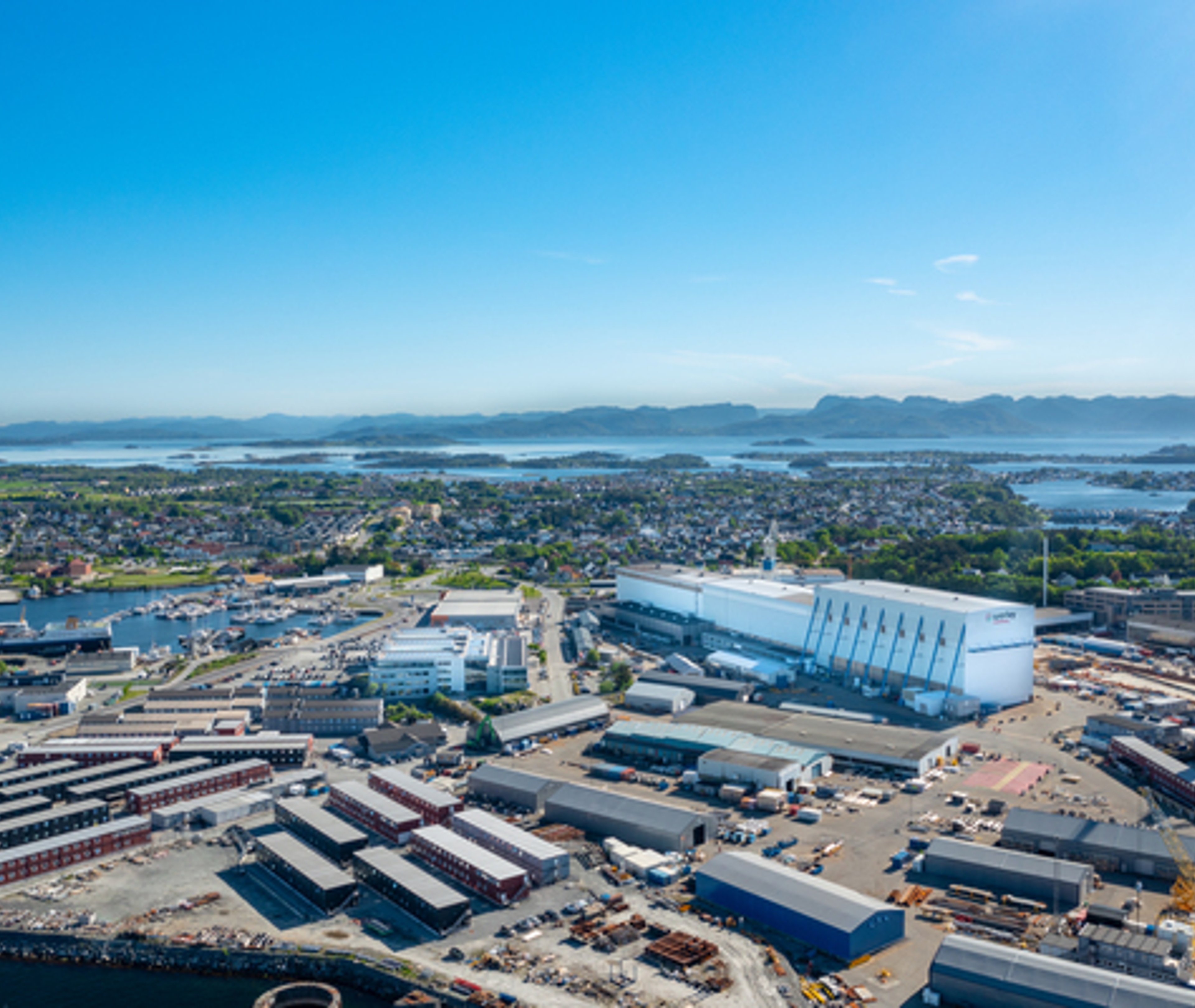 Accommodation for workers and the Rosenberg Shipyard, and the fjord and mountains in the background