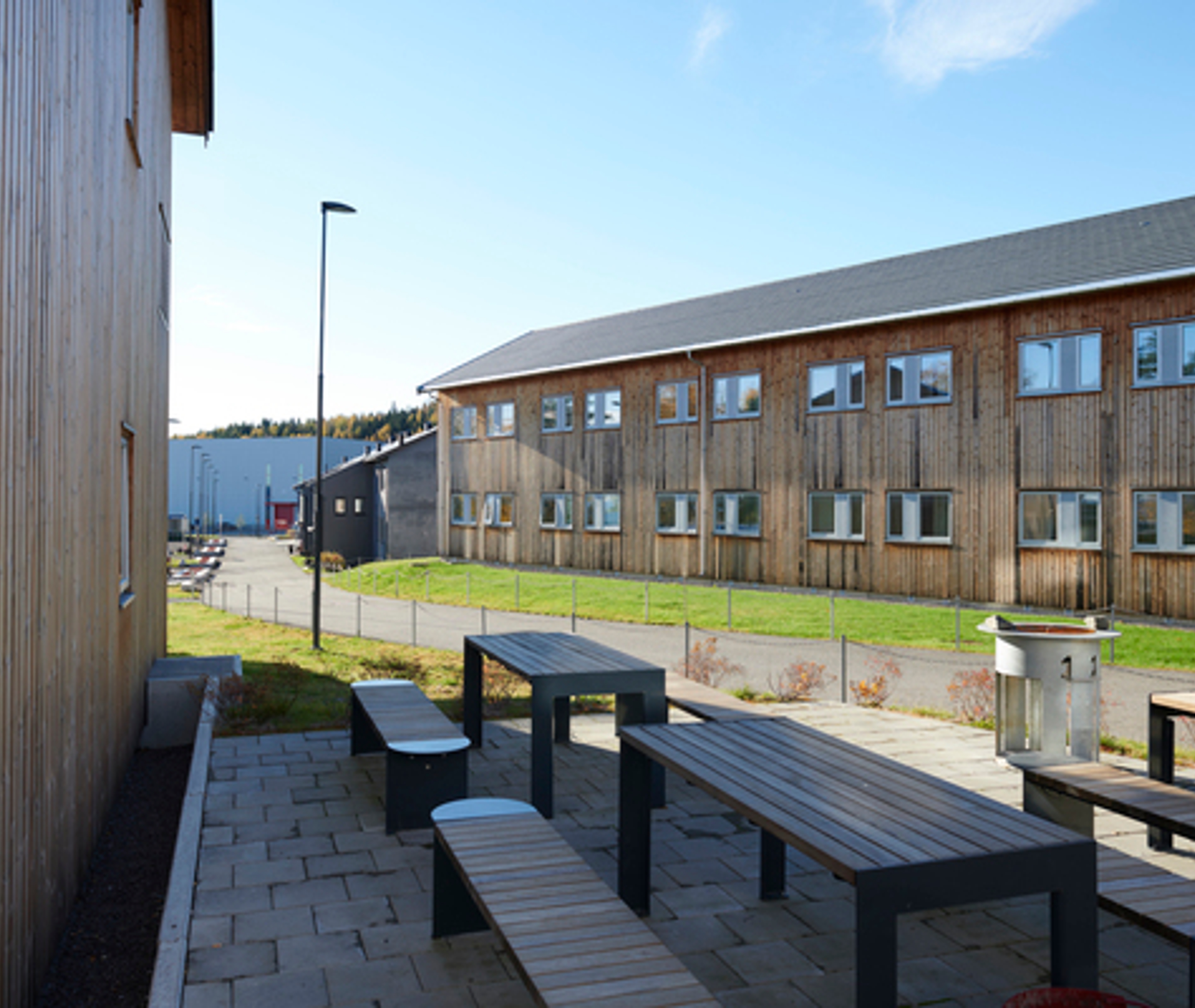 Building with benches and tables outdoors