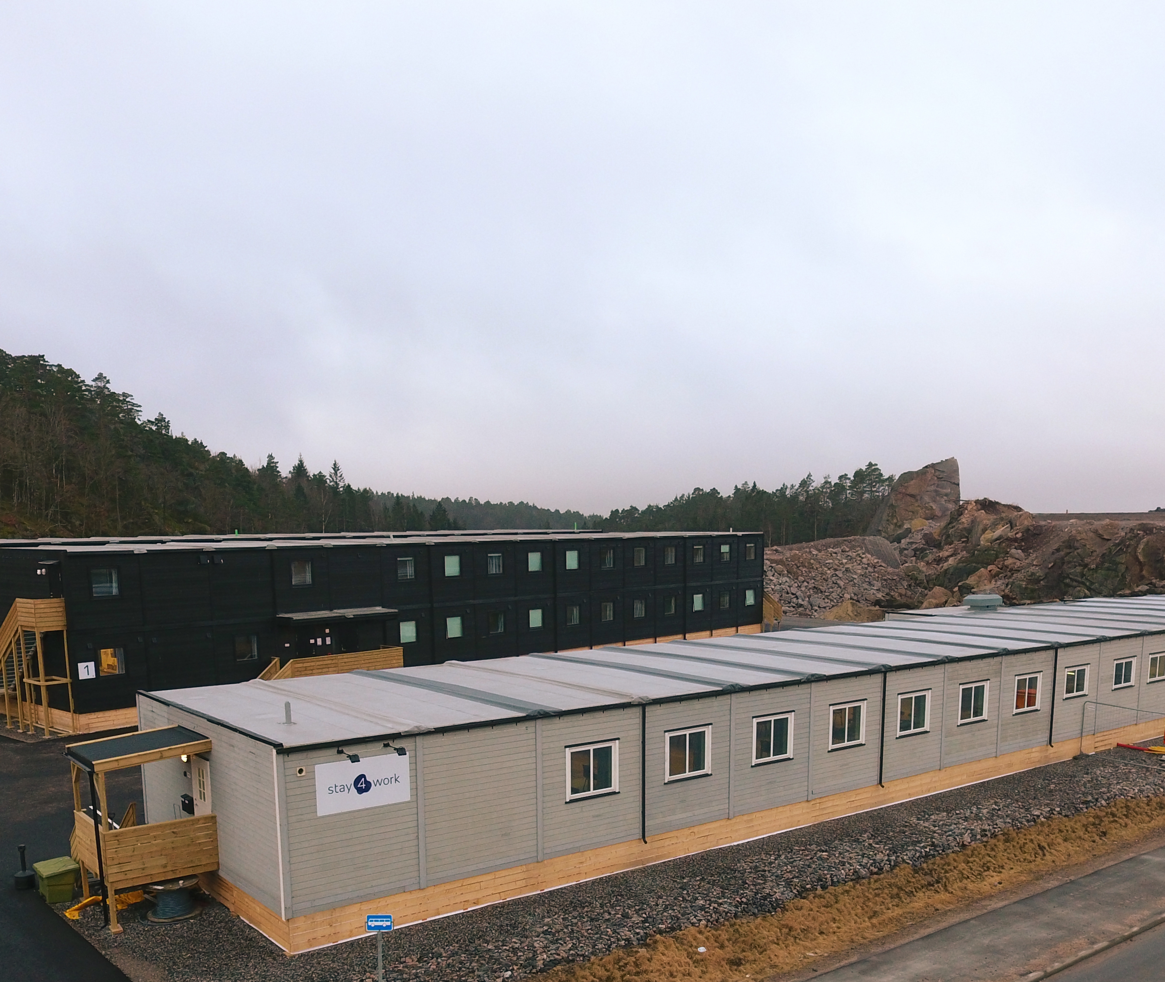 Buildings on a hill with some trees in the background