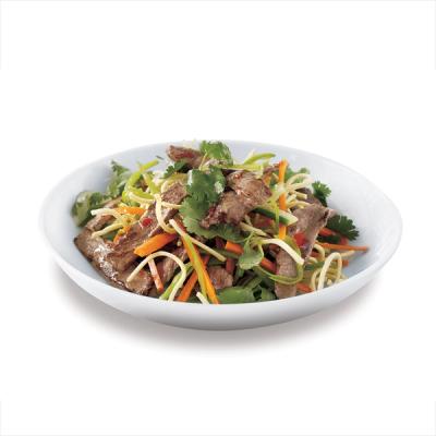 Beef noodle salad with mixed vegetables in a white bowl. Beef noodle salad with mixed vegetables in a white bowl.
