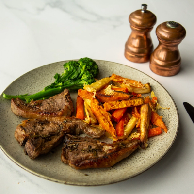 a plate of food with meat and vegetables on a table a plate of food with meat and vegetables on a table