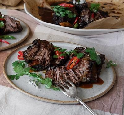 two plates of food with a fork on a table . two plates of food with a fork on a table .