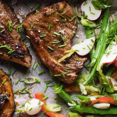 Grilled lamb chops with green beans, radishes, and chives. Grilled lamb chops with green beans, radishes, and chives.