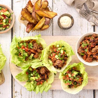 Four lettuce wraps with beef mince and fresh salsa, served with potato wedges and a dipping sauce. Four lettuce wraps with beef mince and fresh salsa, served with potato wedges and a dipping sauce.