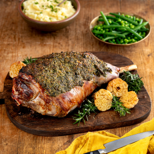 a large piece of meat is sitting on a wooden cutting board a large piece of meat is sitting on a wooden cutting board