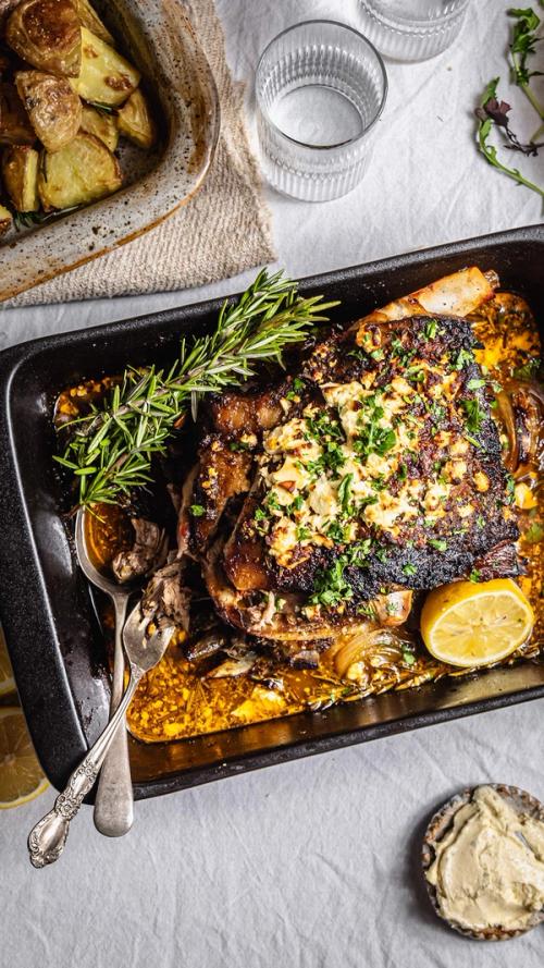 a casserole dish filled with meat and potatoes on a table