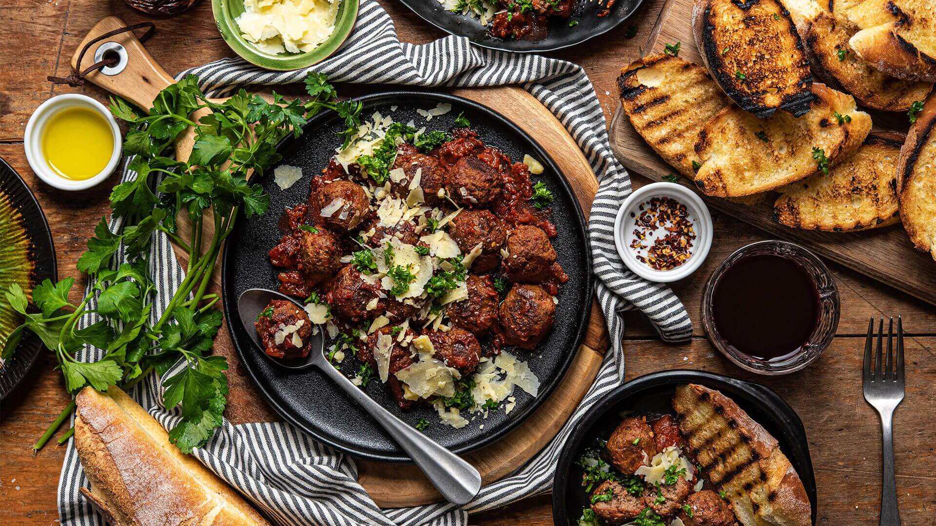 Spicy tomato meatballs served with grilled bread Recipe | Beef + Lamb New Zealand