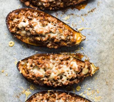 there is a plate of peas and a pan of meatballs on the table . there is a plate of peas and a pan of meatballs on the table .