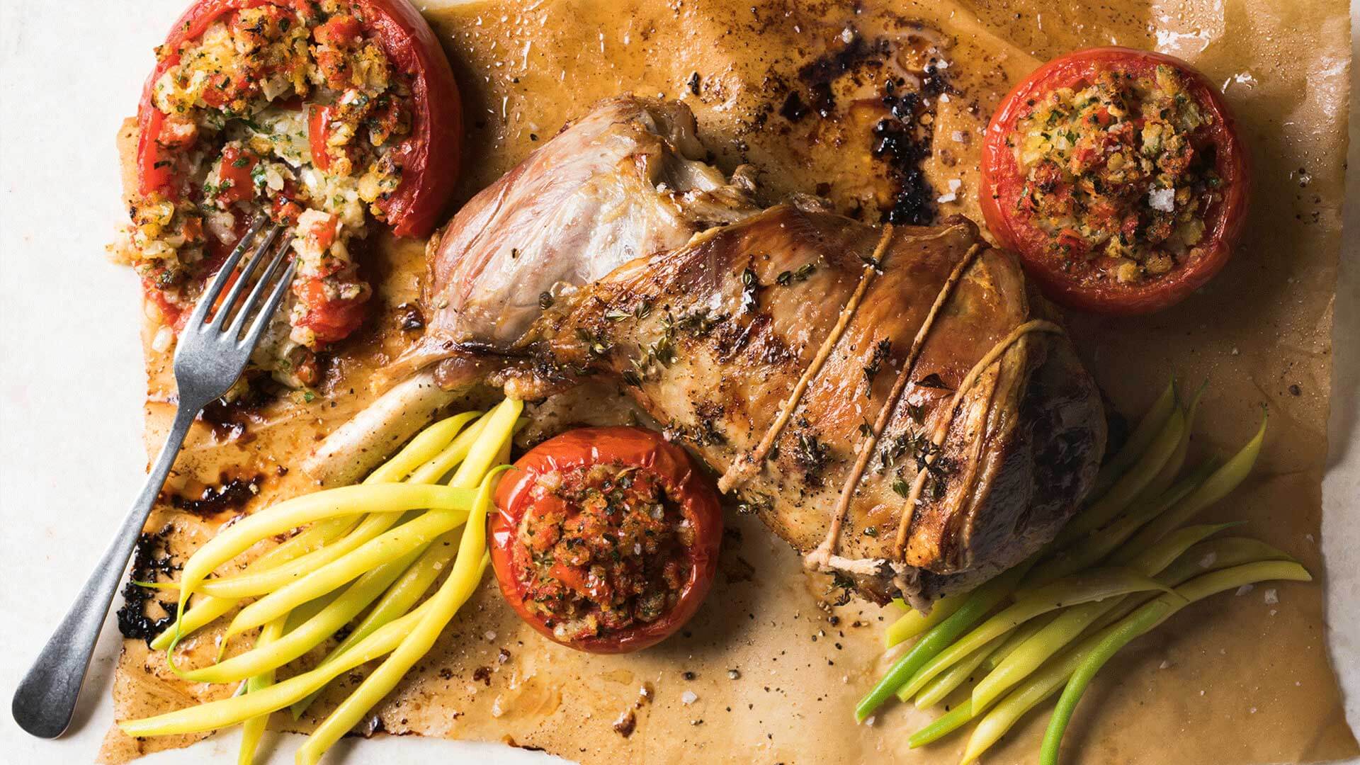 Summer leg of lamb with roasted stuffed tomatoes and butter beans Recipe | Beef + Lamb New Zealand