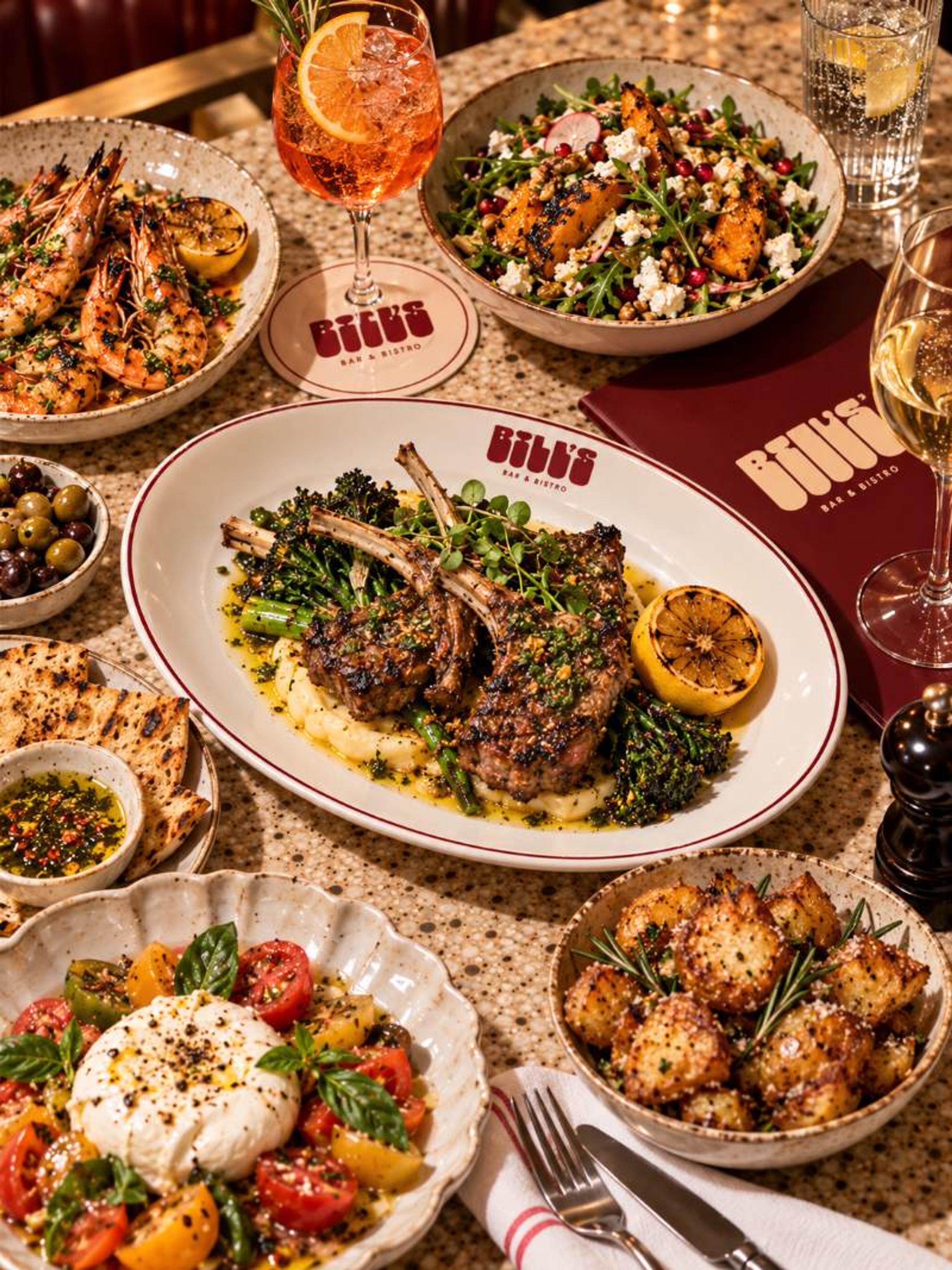 Grilled lamb cutlets on mash with broccolini and a chargrilled lemon on a Bill’s plate