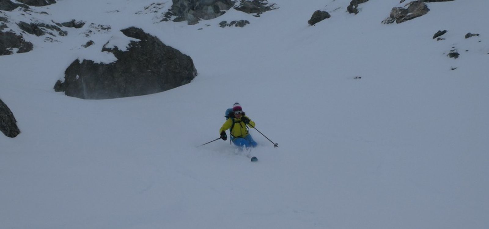 A very happy skier in a couloir in the Queyras