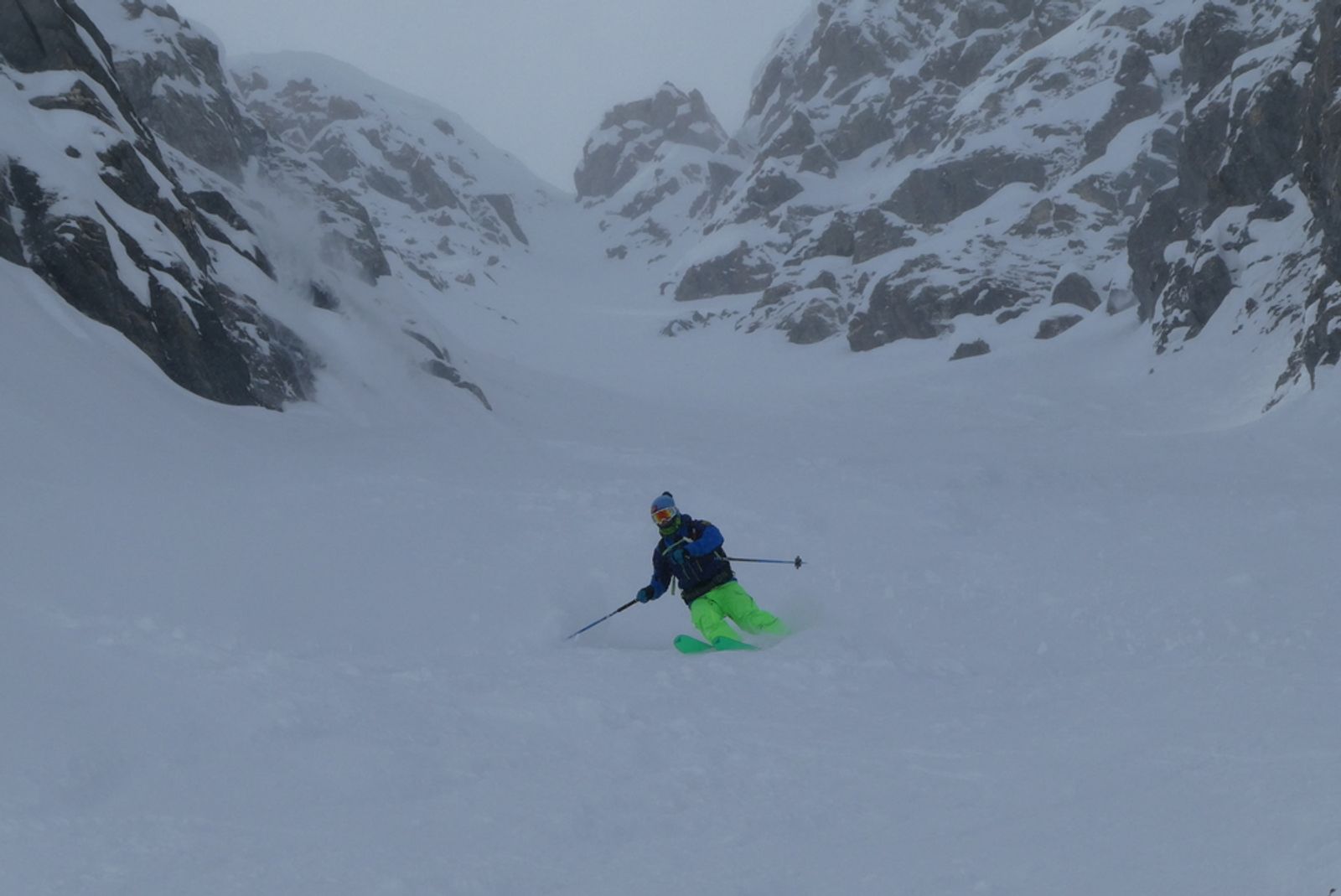A skier tackling a couloir in the Queyras