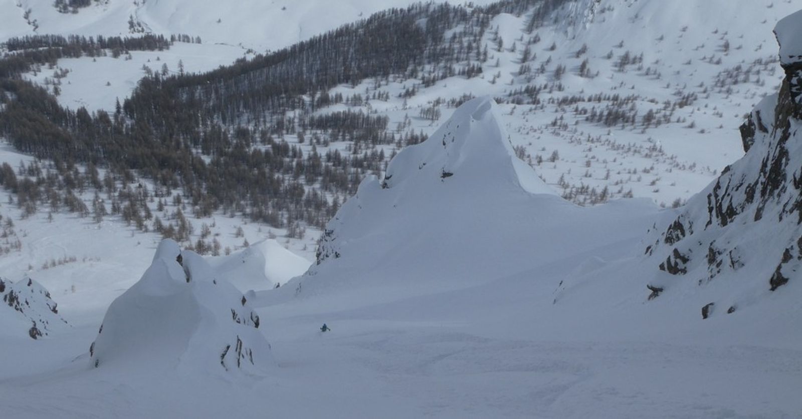 A skier in the lower section of the Baionnette couloir