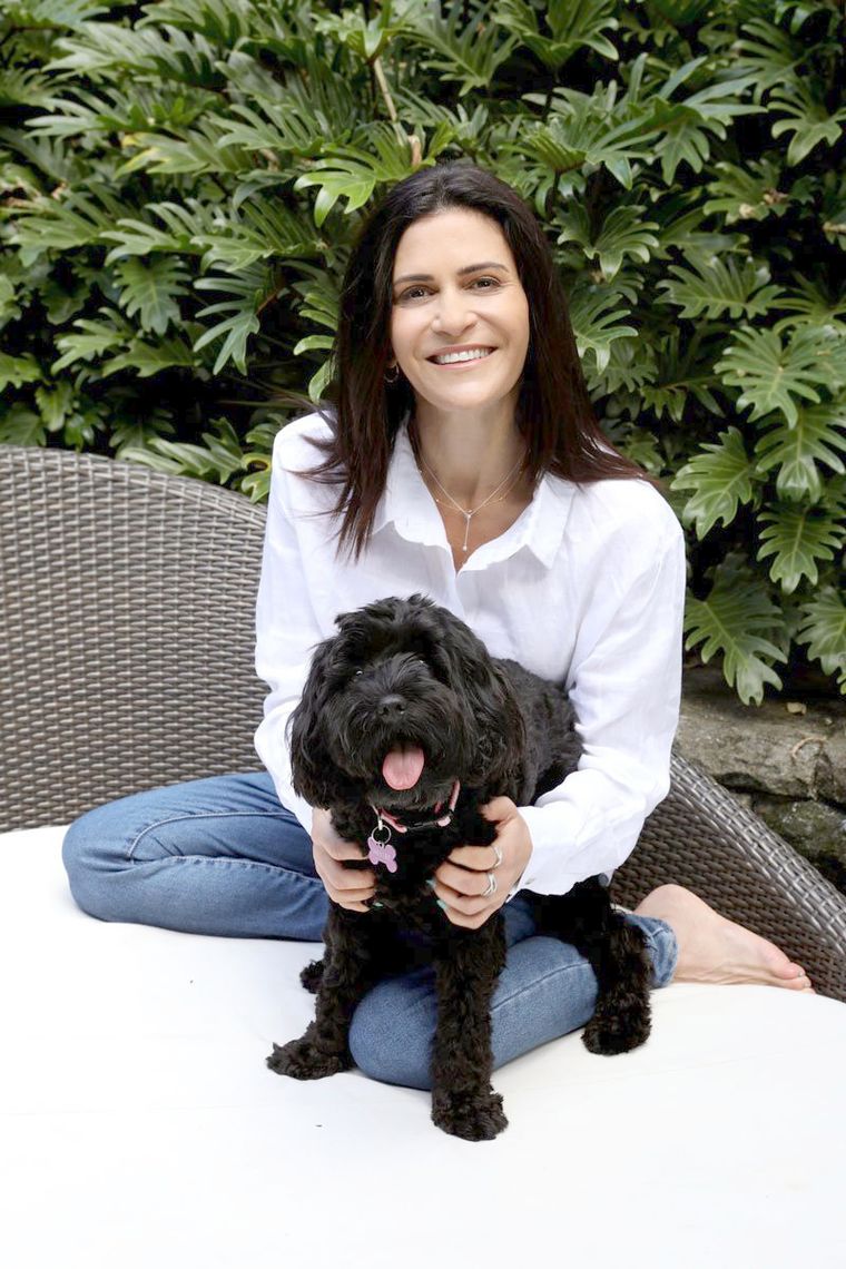 Dr Lisa Myers at home with her dog