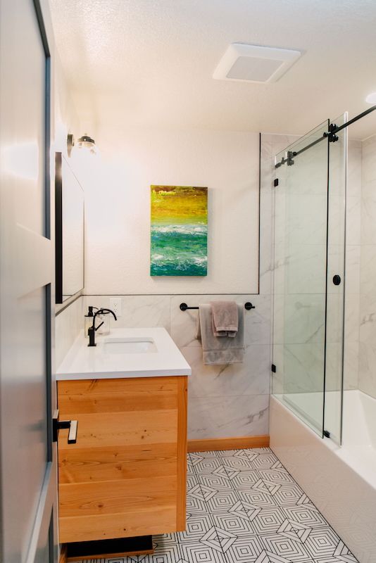 black and white bathroom with wood accents