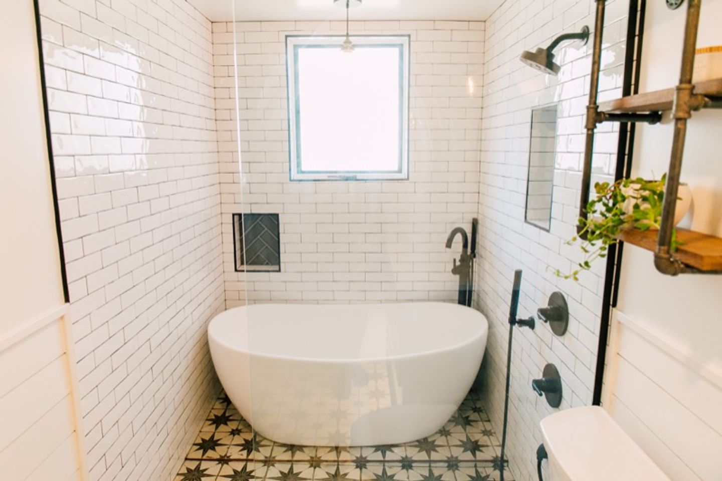 large white soaking tub in bathroom