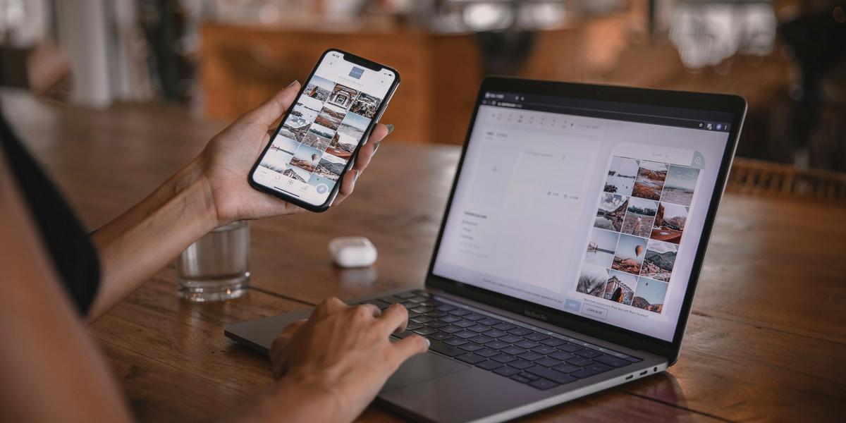 laptop and mobile phone being worked on simultaneously