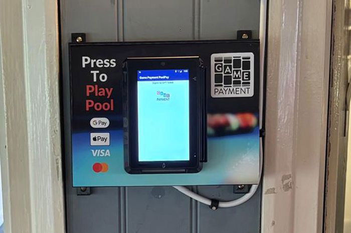 Pool Pay payment terminal mounted on the wall