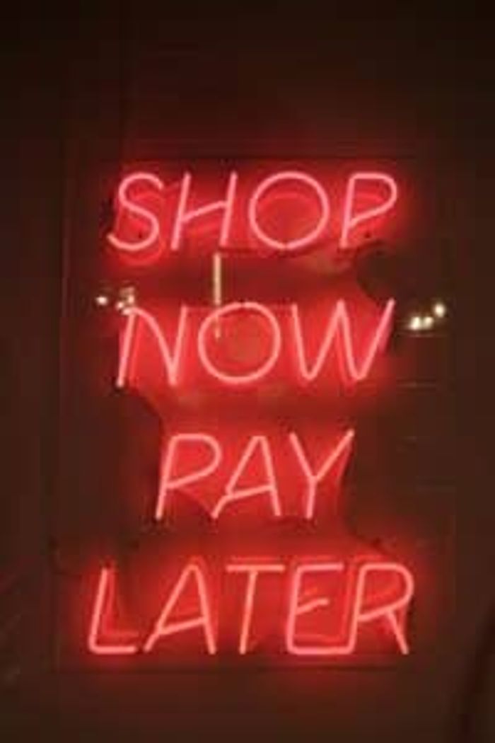 Neon sign displaying shop now pay later