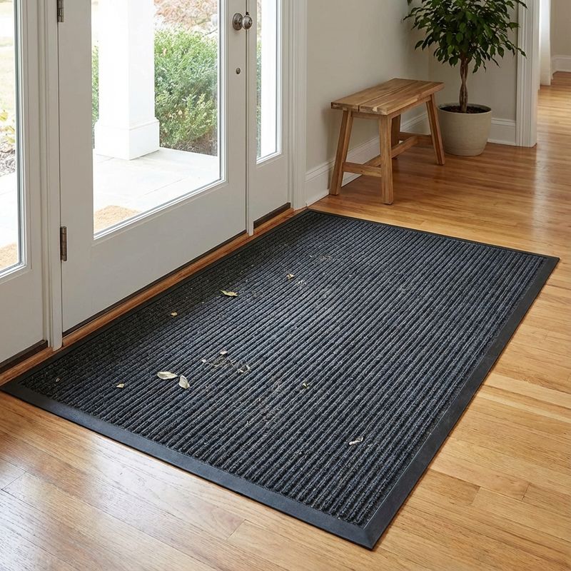 Large entry mat at doorway to trap dirt and outdoor pollutants