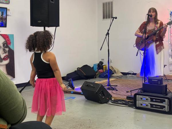 Mer performing as a songwriter at Art All Night