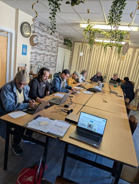 students sat around a table with teacher