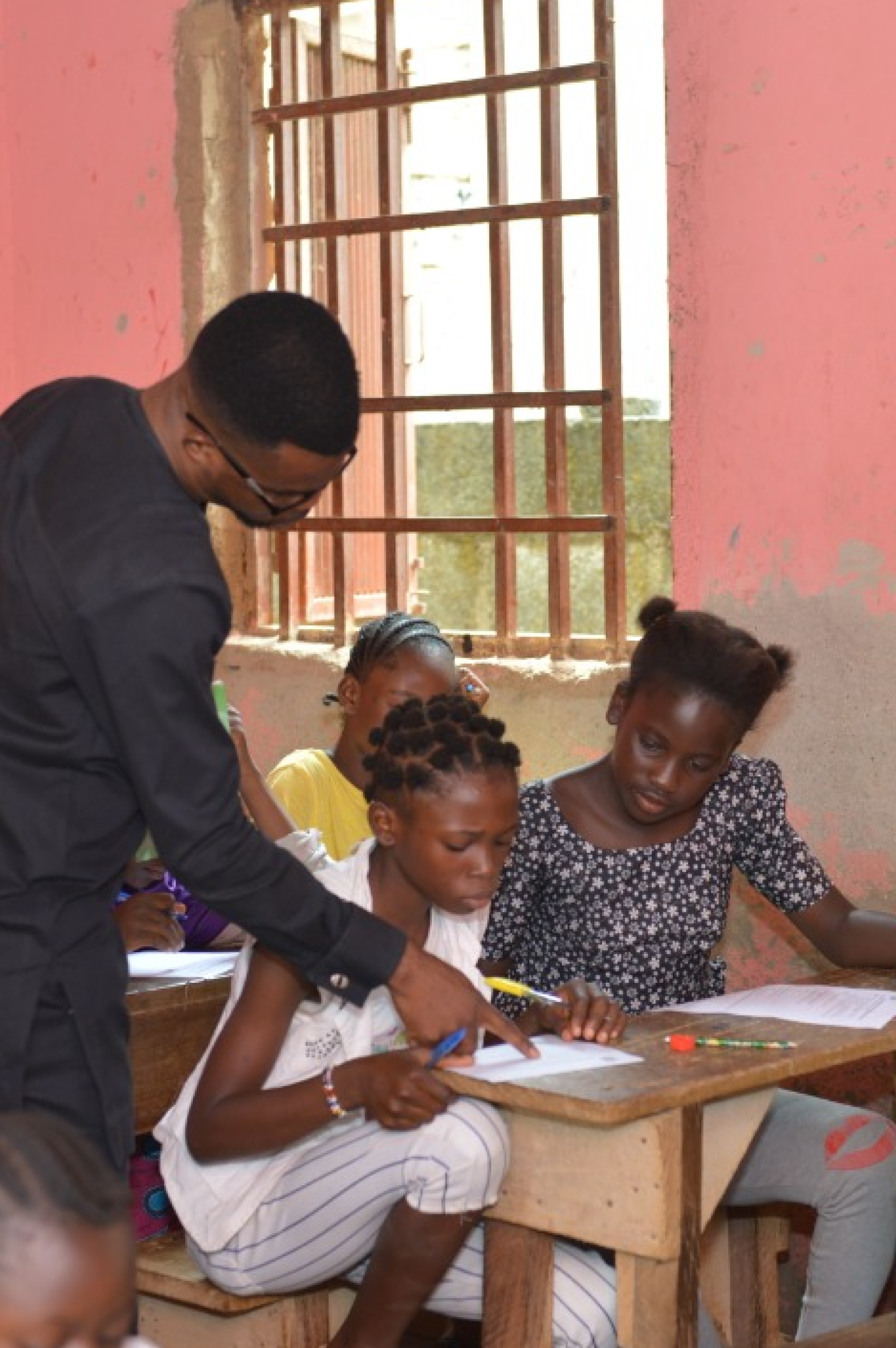 Teacher working with students