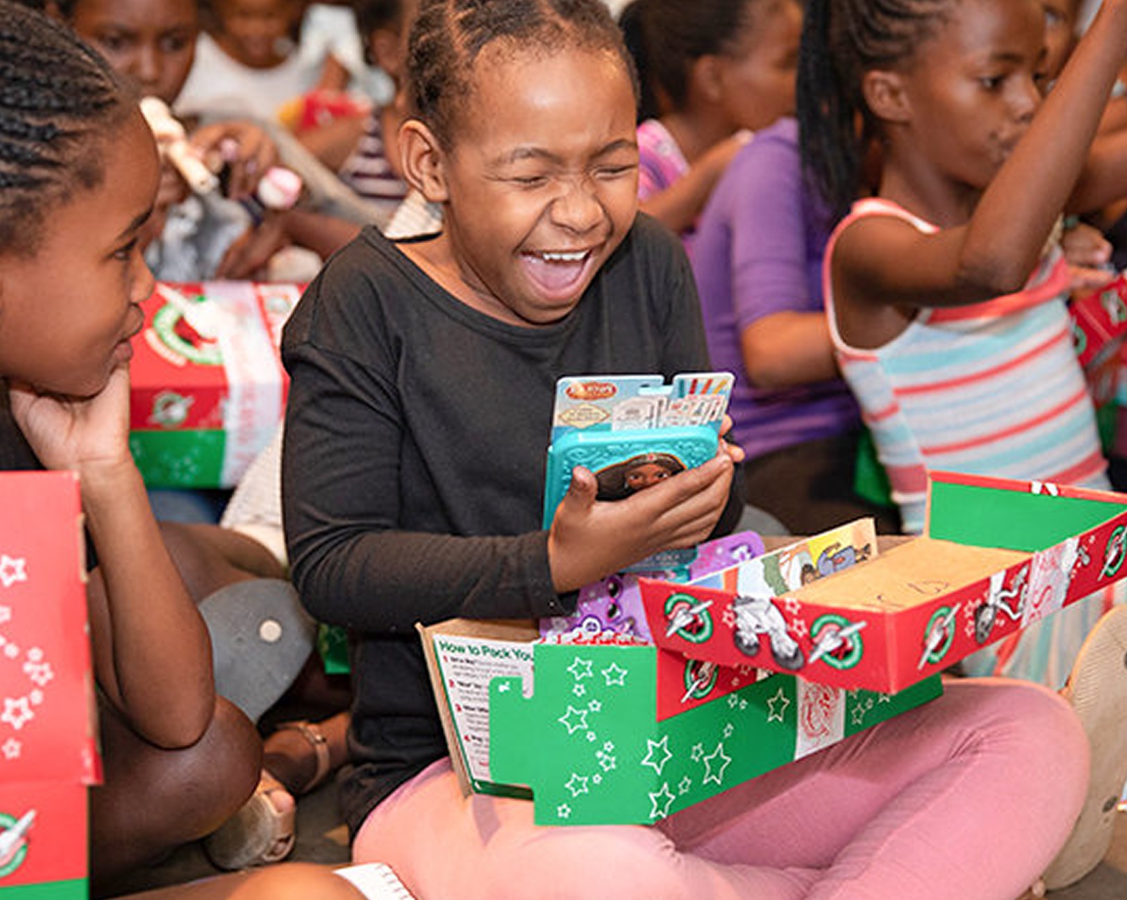 Girls receiving gift packages
