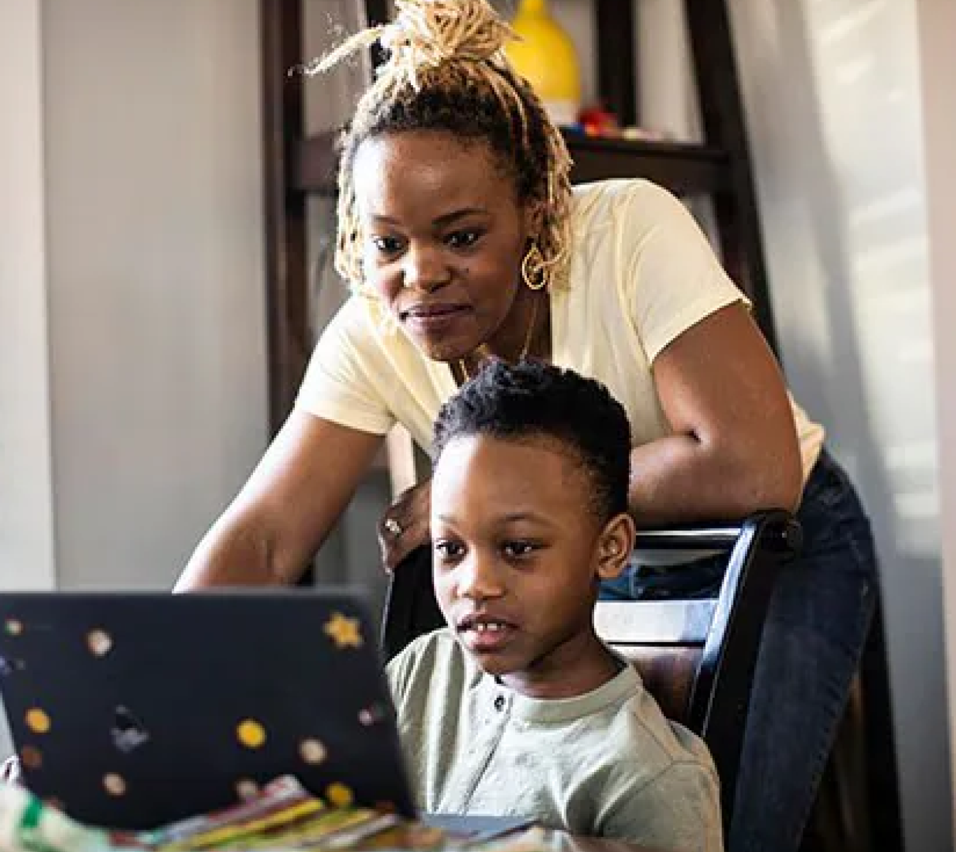 A parent and child using a tablet