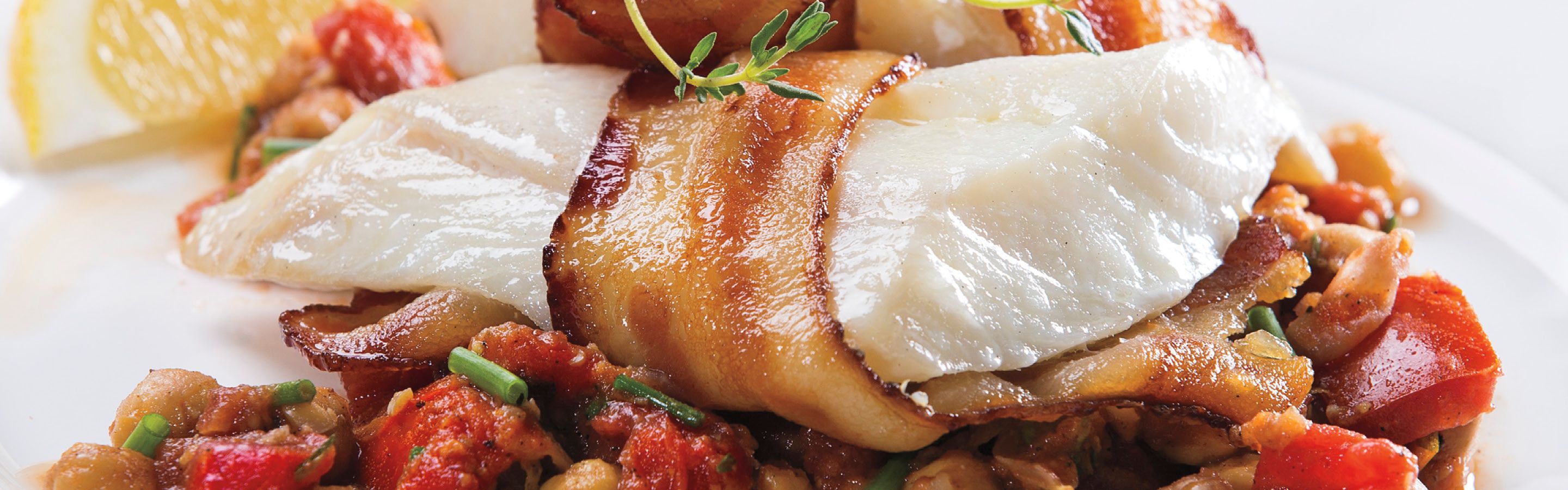 Bacon-Wrapped Cod over Chickpea Sauté