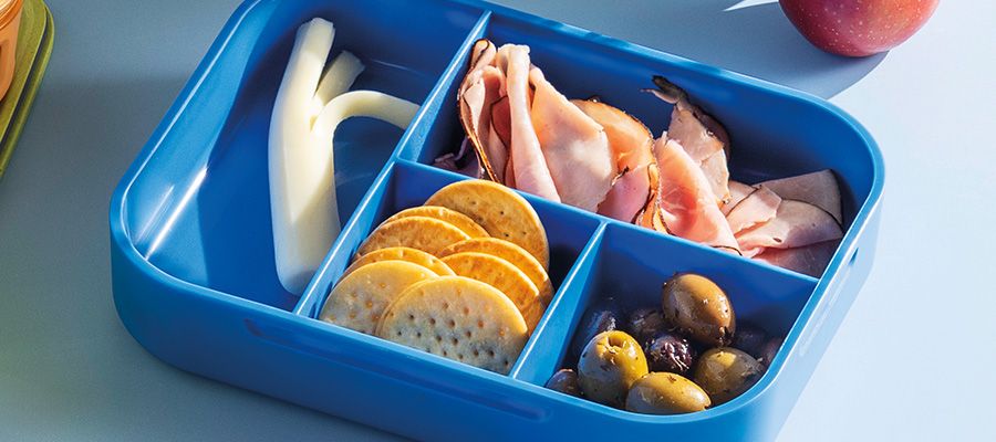 Deli meat black forest ham, Crav'n original crackers, Kraft string cheese and marinated olives