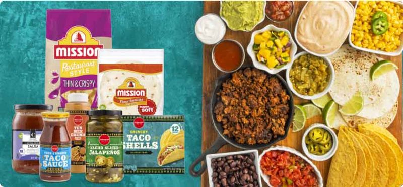 Group shot of items used for tacos along with a board covered in the ingredients.