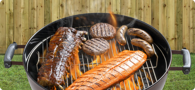 A grill with ribs, burgers, brats, and salmon.