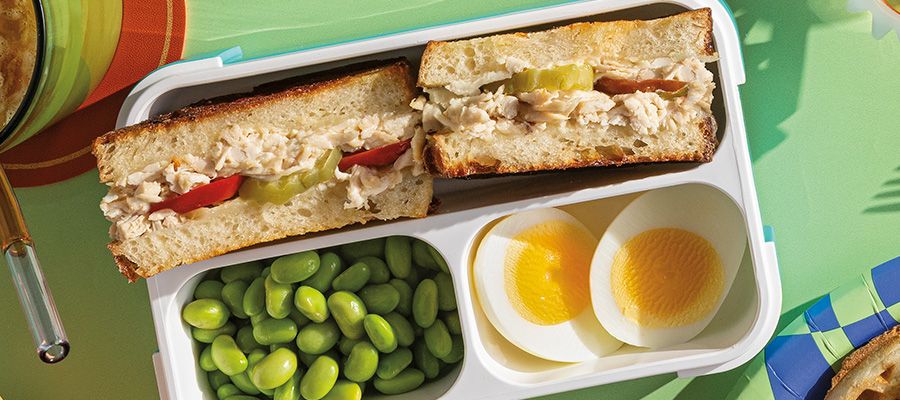 White BBQ Chicken Grilled Cheese with hard-boiled eggs and edamame